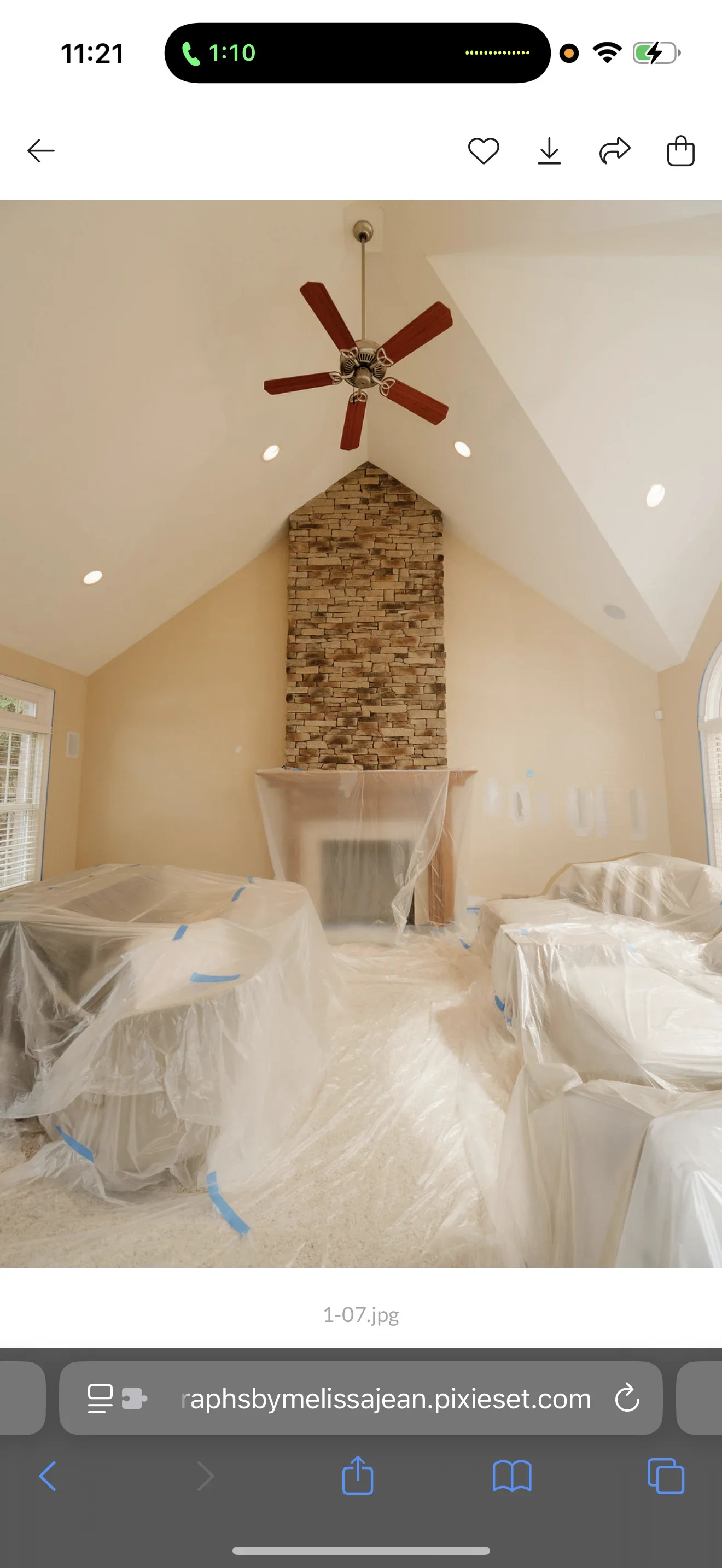 Vaulted ceiling room with cream walls, white painted ceiling, recessed lights, and brick fireplace