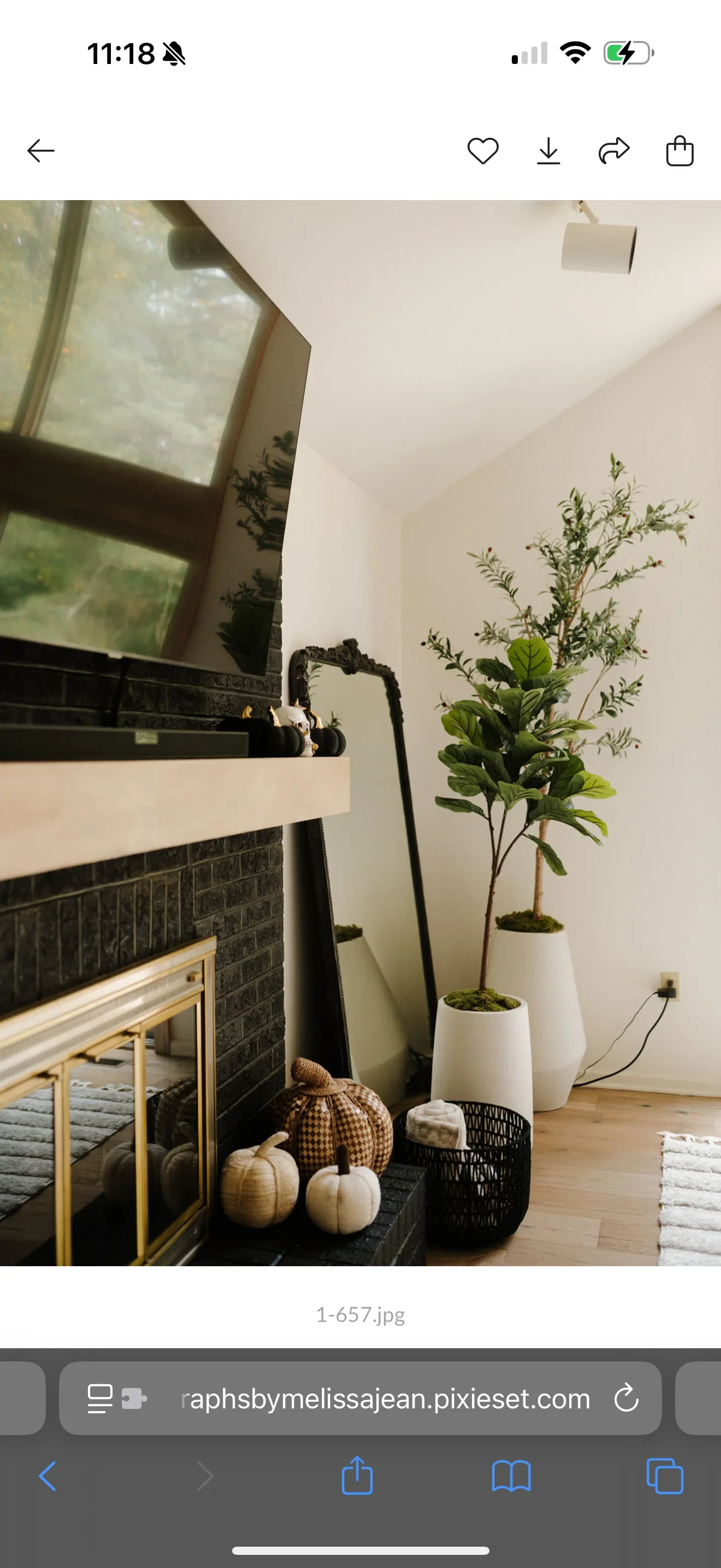 Fireplace with dark tile accent wall, cream mantel, and freshly painted white walls