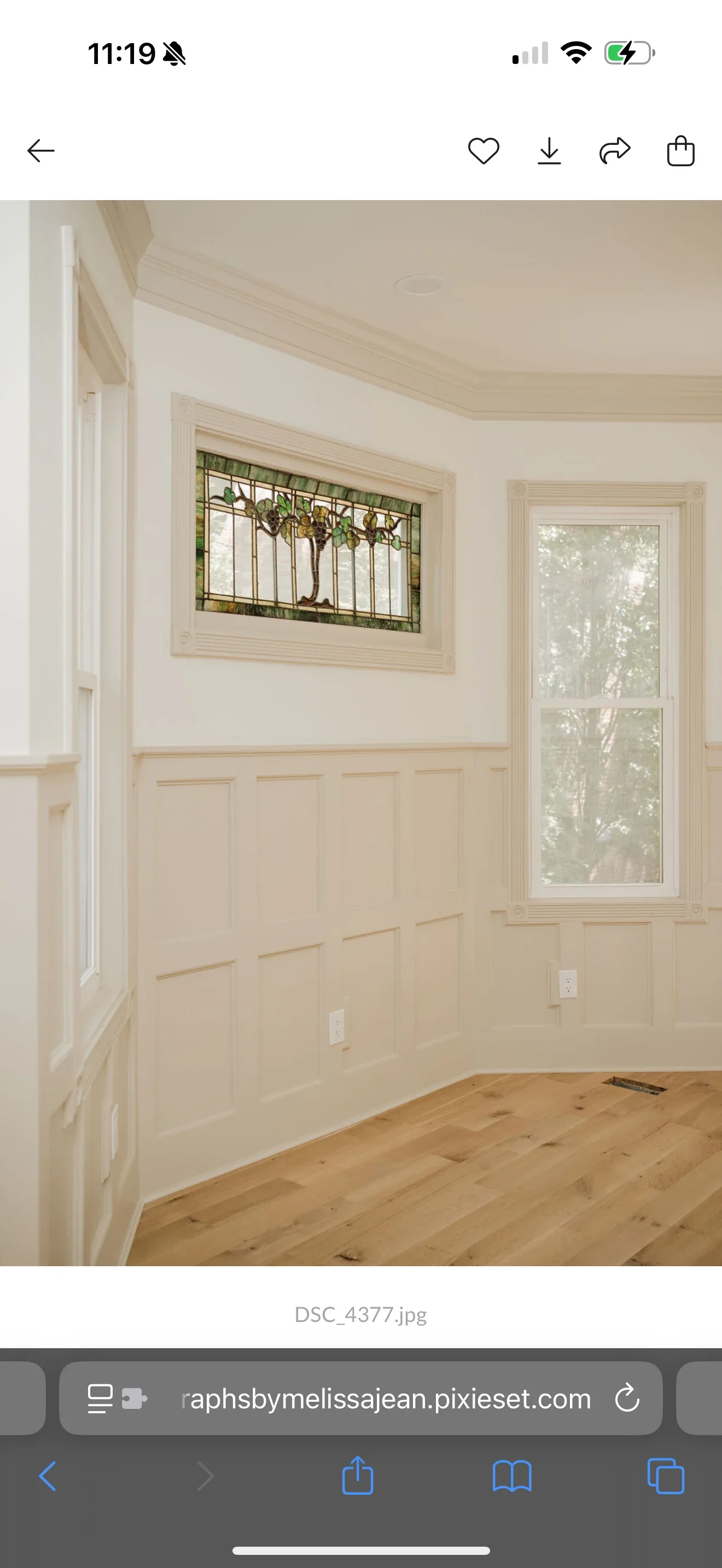 Cream wainscoting with painted walls, stained glass window, and white trim in residential interior