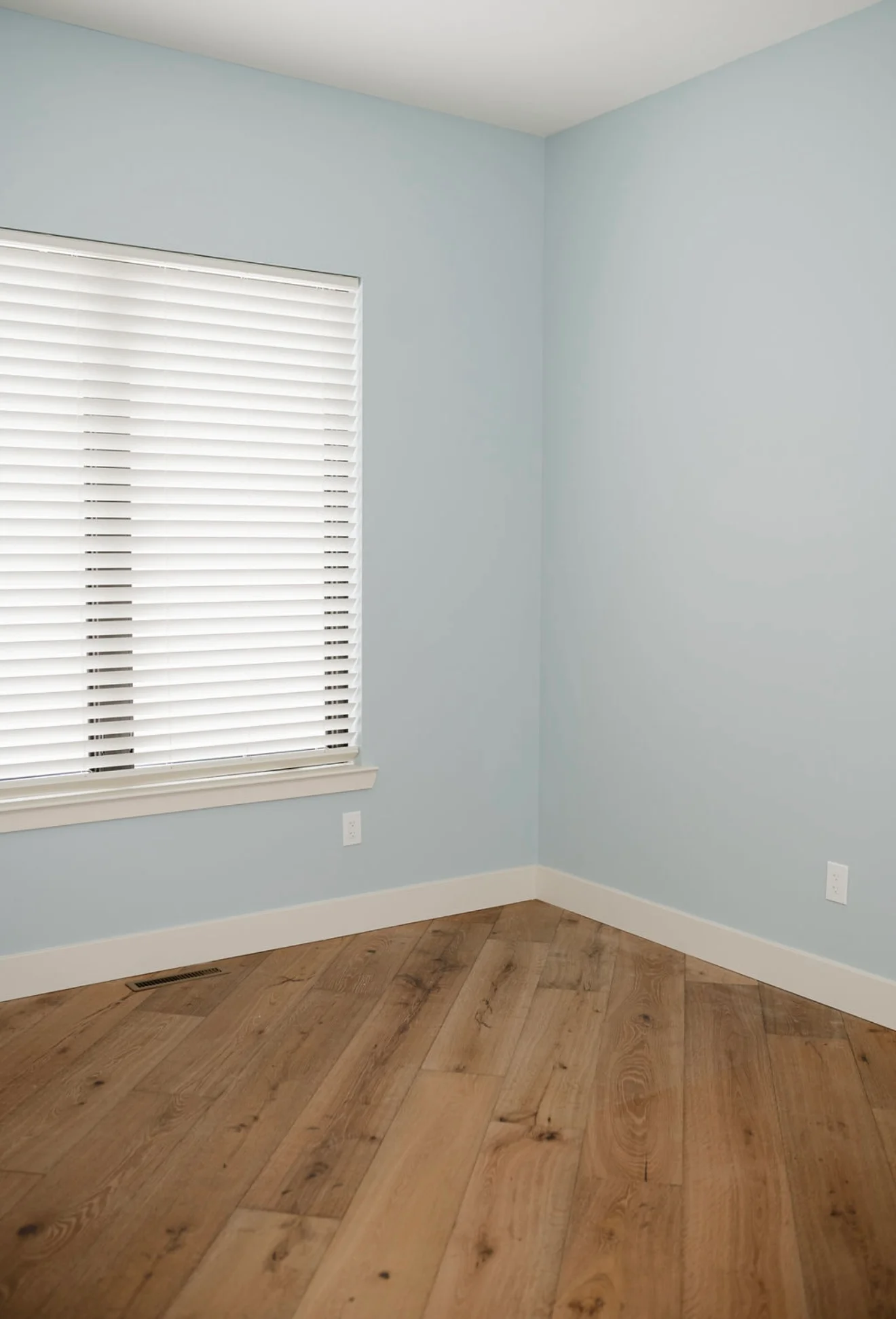 Newly installed hardwood flooring in residential living room